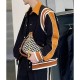 Alicia Vikander Irma Vep Mira Varsity Wool Black and Brown Jacket Alicia Vikander Irma Vep Mira Varsity Wool Black and Brown Jacket